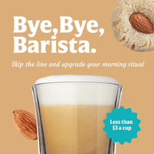 A glass of frothy FlavCity Cafe Sweet Almond Drop Latte with an almond and a baked almond cookie, plus the text "Bye, Bye, Barista. Skip the line and upgrade your morning ritual for less than $3 a cup—made with creamy grass-fed whole milk.