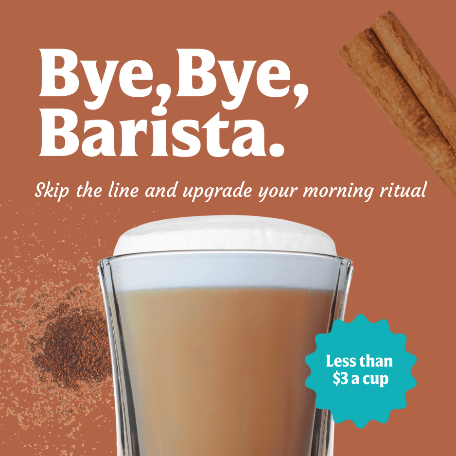 A glass of FlavCity Cafe’s Cinnamon Dolce Latte made with grass-fed whole milk sits before a brown background. Skip the line—enjoy your morning ritual for less than $3 a cup, topped with foam, cinnamon sticks, and powder. Bye, Bye, Barista!.