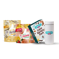 Four FlavCity Cafe products are shown: the Daily Ritual Bundle with Vanilla Cream Protein Smoothie, Lemon Anytime Essential Drink Mix, Latte Variety Pack, and a white FlavCity Cafe shaker bottle on a white background.