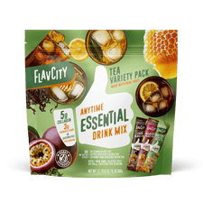 Front view of FlavCity Anytime Essentials Drink Mix Tea pouch with bold branding, flavor name, and calming tea leaf graphics on a green and white background.