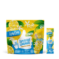 FlavCity Superfood Lemonade powder package with lemon slices and green leaves on a white background