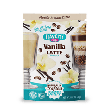 A package of FlavCity Cafe Latte Variety Pack features vanilla flowers, coffee beans, and two latte glasses. The text highlights it as an all-in-one, instant latte assortment in single-serving packets for indulgent, naturally crafted lattes.