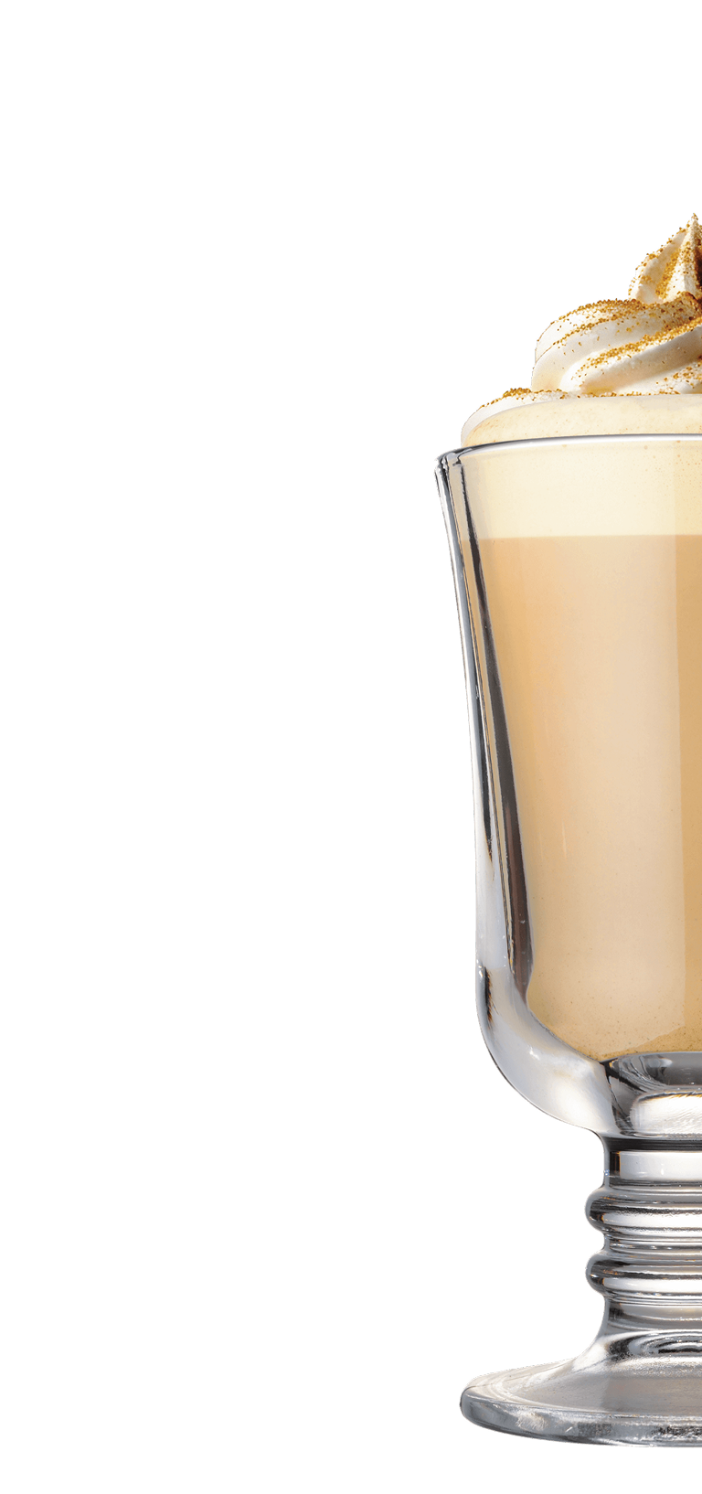 A glass mug filled with a creamy, light brown beverage, topped with whipped cream and a sprinkle of cinnamon, set against a plain white background.