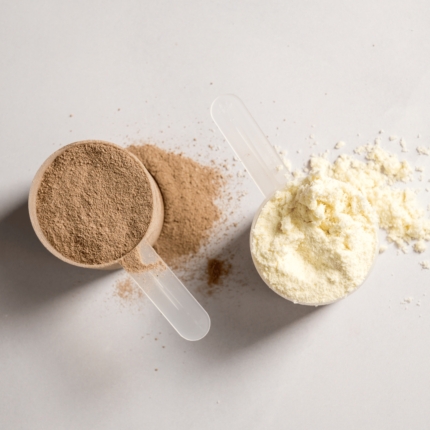 A scoop of chocolate and vanilla protein pwoder.