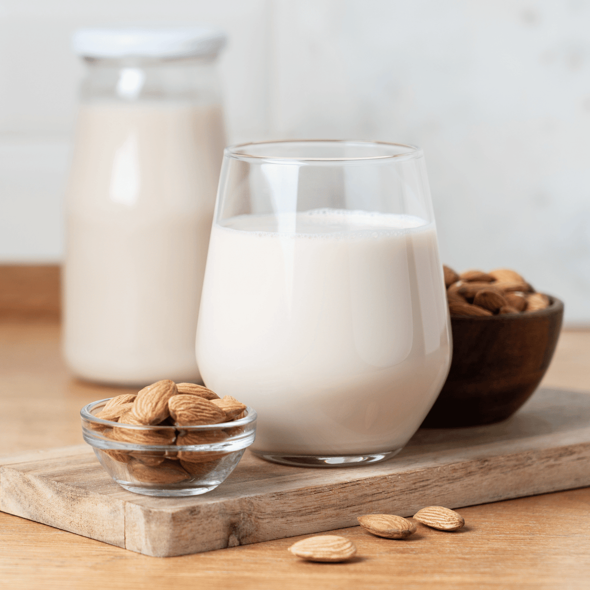 A milk and nuts on the table.
