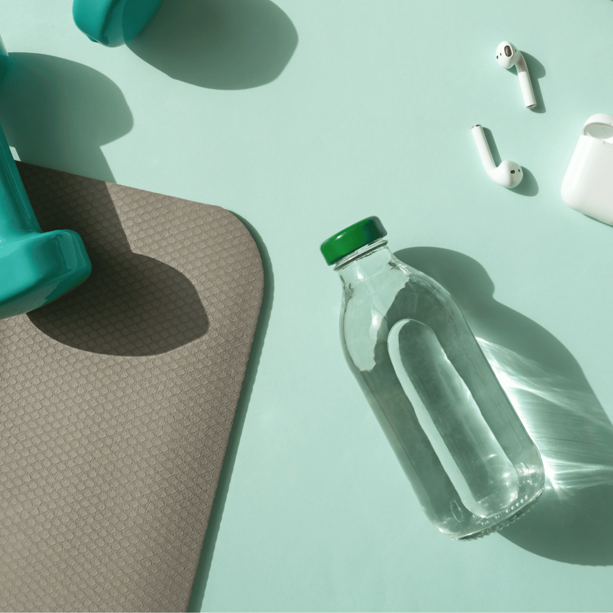 A bottle of water and a pair of earbuds.