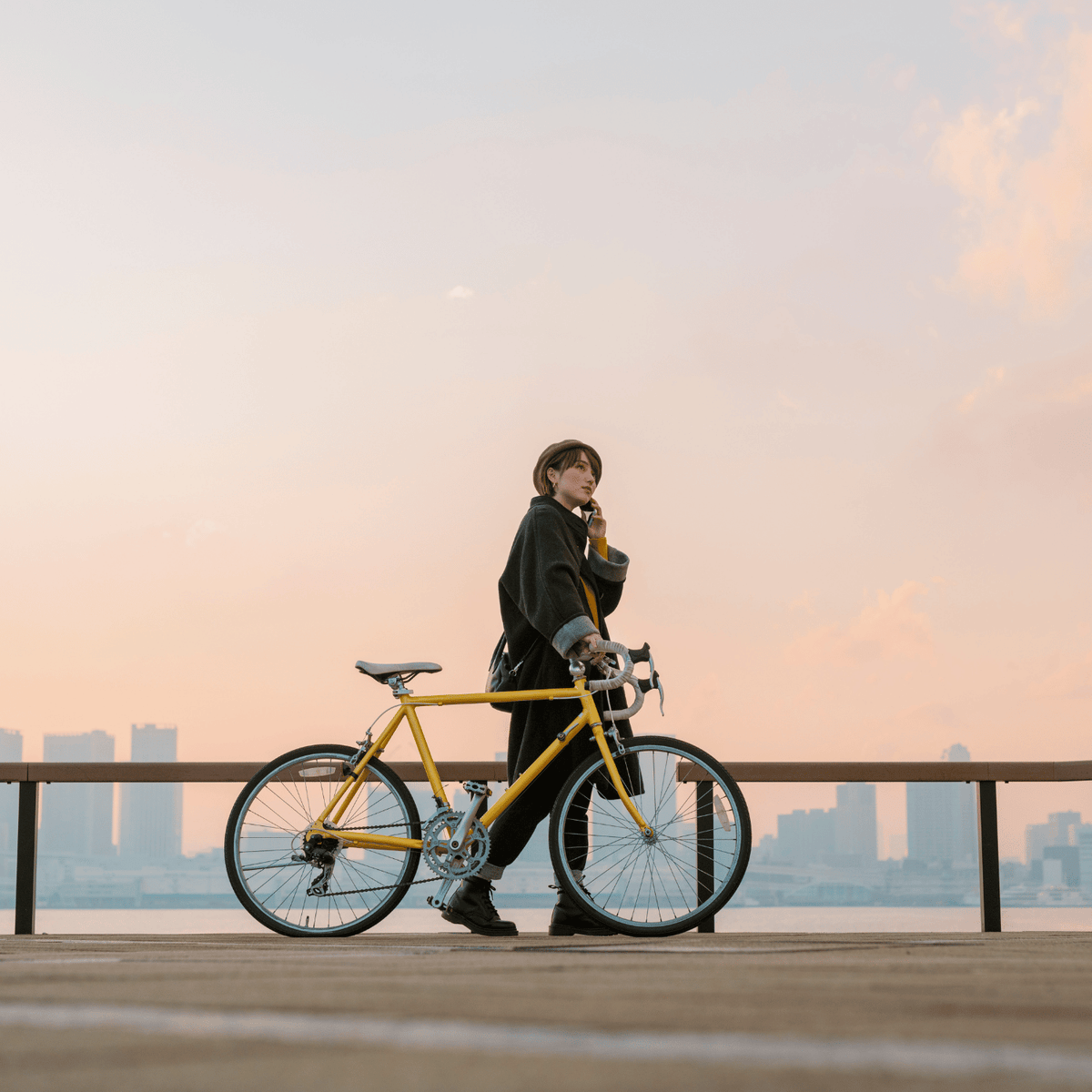 A man with a bicycle.