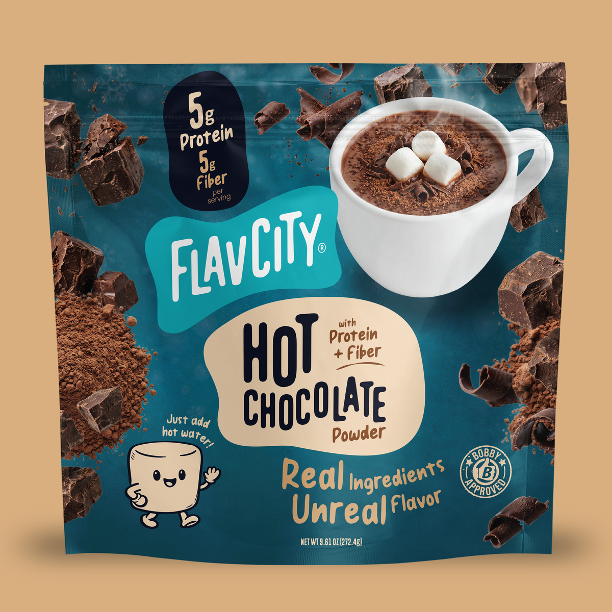 A pouch of FlavCity Hot Chocolate Mix in Single-Serve Packets featuring a cup of cocoa with marshmallows, chocolate chunks, and cocoa powder, with text highlighting 5g of protein and fiber per serving.