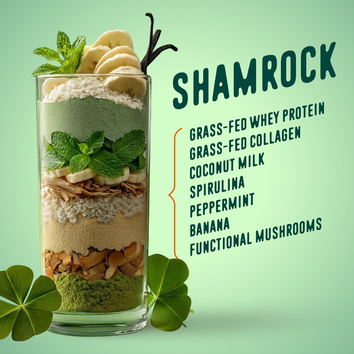 A tall glass of Shop FlavCity’s Shamrock Protein Smoothie—layered and topped with banana slices, mint, and two shamrock leaves. Ingredients: grass-fed whey protein, collagen, coconut milk, spirulina, peppermint, banana & mushrooms.
