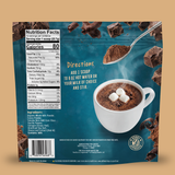Back of a Shop FlavCity Hot Chocolate Mix in Single-Serve Packets pouch displaying a Nutrition Facts label, ingredients, instructions, and an image of a mug of rich hot chocolate topped with marshmallows.