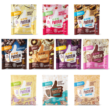 Collection of FlavCity protein smoothie powder packets featuring various flavors including Vanilla Cream, Berries and Cream, Chocolate Peanut Butter, Chocolate, Butter Coffee, Brownie Batter, and Vanilla Latte. Regular and plant-based vegan options shown with colorful packaging designs. Each packet contains 25g protein and all-in-one smoothie formula