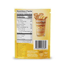 A yellow packet of Shop FlavCity Banana Bread Protein Smoothies features a parfait image with bananas, granola, and cookies. The nutrition facts label indicates 180 calories per serving, and both the barcode and manufacturer information appear at the bottom.