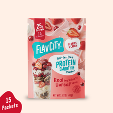 Shop FlavCity Berries & Cream Protein Smoothie Packets single-serving pouch labeled with 25g protein and 10g collagen, featuring graphics of strawberries and cream, with a separate tag noting 15 packets.