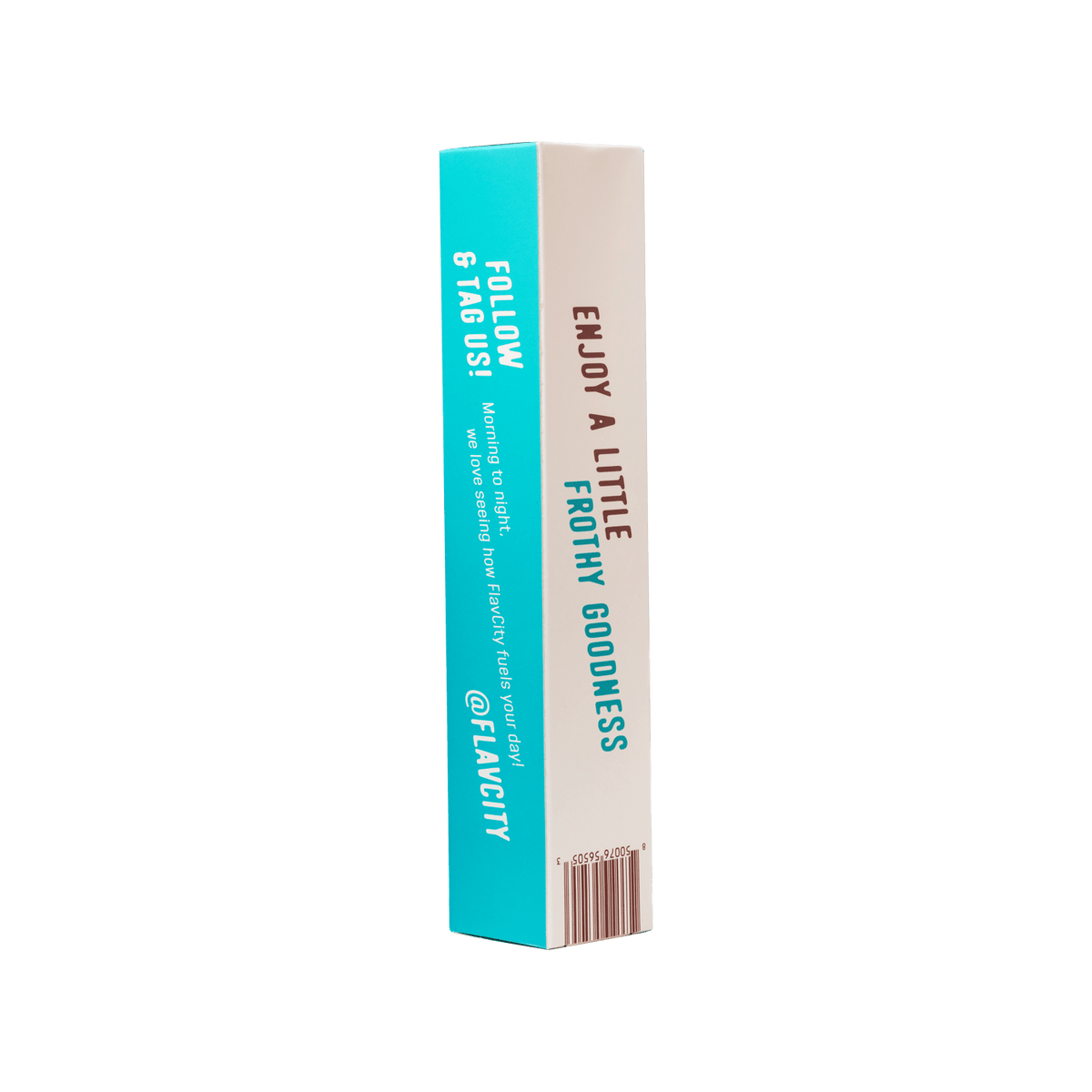 A rectangular FlavCity Frother box stands upright. One turquoise side has white text: follow and tag @FLAVCITY; the other white side features brown and turquoise text: ENJOY A LITTLE FROTHY GOODNESS—perfect for your latte frother. Brand: FlavCity Cafe.