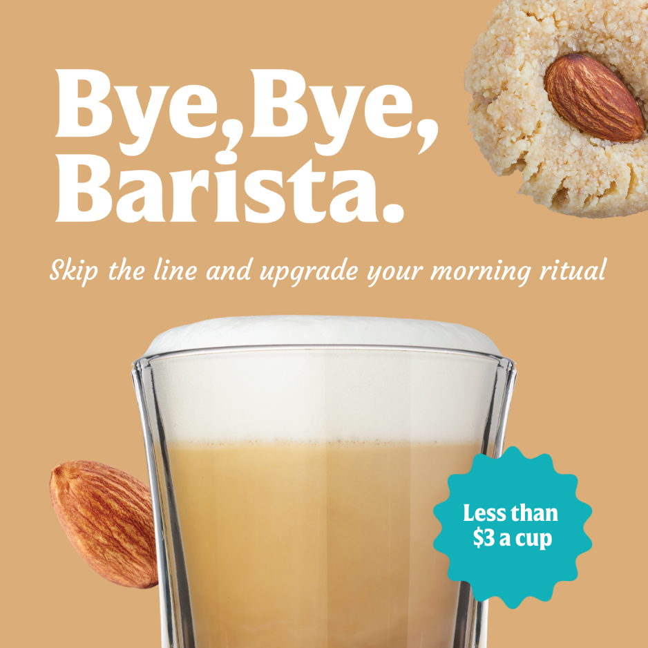 A glass of frothy FlavCity Cafe Sweet Almond Drop Latte with an almond and a baked almond cookie, plus the text "Bye, Bye, Barista. Skip the line and upgrade your morning ritual for less than $3 a cup—made with creamy grass-fed whole milk.