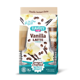 A package of FlavCity Café Vanilla Latte Powder featuring images of two vanilla lattes, coffee beans, and vanilla flowers. Text highlights All-in-one, Naturally crafted, and a net weight of 32.45 oz (920g).