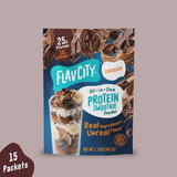 A single serving packet of FlavCity Chocolate Protein Smoothie Packets featuring an image of a smoothie in a glass topped with banana slices and chocolate shavings.