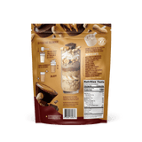Back of Shop FlavCity’s Chocolate Peanut Butter Protein Smoothie bag shows a smoothie illustration, prep instructions, ingredients with collagen protein and grass-fed whey, nutrition facts, plus images of peanut butter cups and peanuts on a brown background.