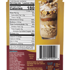 Back of a Shop FlavCity Chocolate Peanut Butter Protein Smoothie Packets box displaying nutrition facts, ingredients list, manufacturer’s details, barcode, and a tall glass showcasing layers of nuts, protein powder, and chocolate pieces.