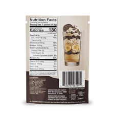 Back of a FlavCity Cafe Bobby's Picks dessert mix package featuring nutrition facts, ingredients, barcode, and a photo of a parfait with whipped cream, chocolate, bananas, cookie pieces—now with grass-fed whey protein for an added boost.