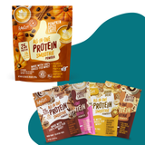 Five Cozy Cafe protein smoothie powder pouches from Shop FlavCity—in café-inspired flavors including Pumpkin Spice Latte, Vanilla Latte, Strawberry, Banana Bread, and Butter Coffee with added collagen—are displayed on a white surface against a teal abstract background.