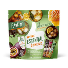 Front view of FlavCity Anytime Essentials Drink Mix Tea pouch with bold branding, flavor name, and calming tea leaf graphics on a green and white background.