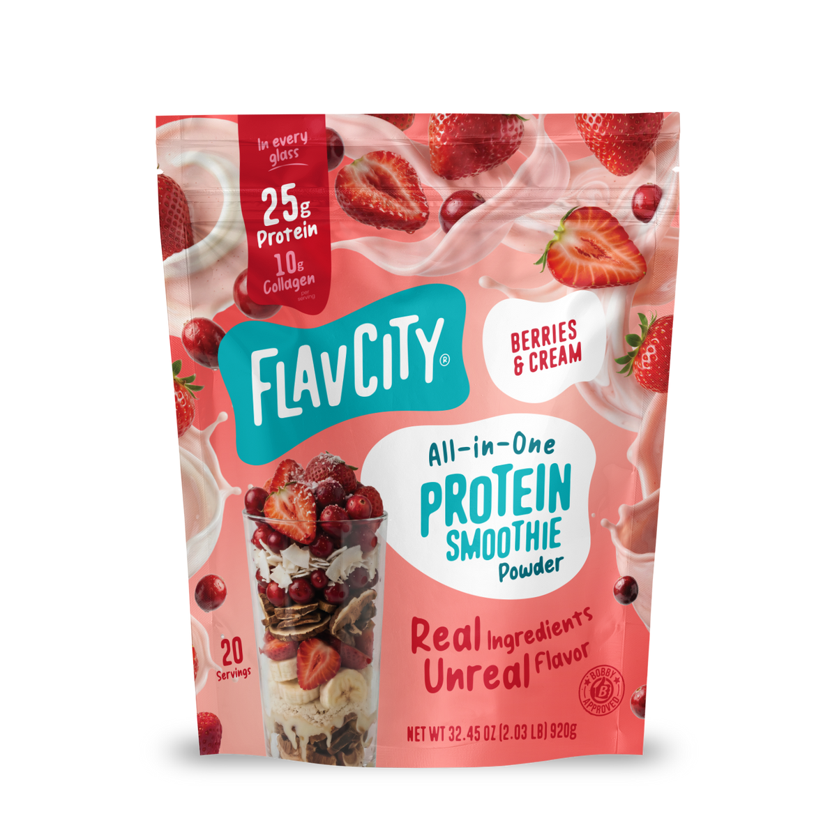 A pouch of Shop FlavCity Berries & Cream Protein Smoothie powder next to a glass filled with the mix, surrounded by splashing milk, fresh strawberries, and collagen.