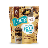 A Shop FlavCity Butter Coffee Protein Smoothie pouch featuring images of coffee, butter, and a glass layered with banana slices and chocolate chunks, formulated with grass-fed whey.