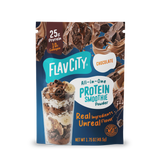 A single-serve packet of FlavCity Protein Smoothie Single-Serve Chocolate featuring images of chocolate chunks and a glass of smoothie layered with banana slices and chocolate shavings.