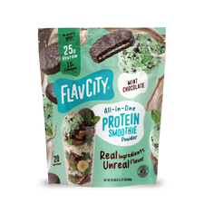 A pouch of Shop FlavCity Mint Chocolate Protein Smoothie powder, featuring images of a chocolate mint cookie, scoops of mint chip ice cream, a glass of the blended drink, and mint leaves to highlight this grass-fed whey and collagen blend.