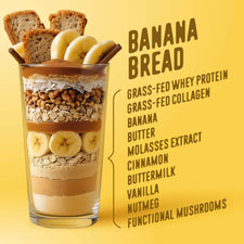 The Shop FlavCity Banana Bread Protein Smoothie features layers of banana, oats, nuts, whipped cream, and pieces of grass-fed whey banana bread, displayed next to a banana bread ingredient list on a yellow background.
