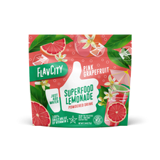 A vibrant pouch of Shop FlavCity Grapefruit Lemonade features grapefruit slices and lemonade on a pink-green background. This sugar-free, healthy drink mix is packed with vitamin C for a refreshing boost.