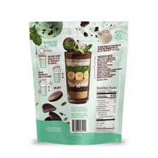 The back of a Shop FlavCity Mint Chocolate Protein Smoothie pouch features a layered smoothie with banana slices, chocolate, and mint leaves, plus ingredients, nutrition facts, collagen content, and prep instructions on light green packaging.