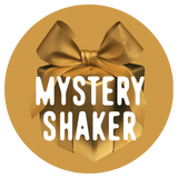 A gold gift box with a large bow is centered in a gold circle, featuring the words "Shop FlavCity Mystery Shaker" in bold white letters across the front.