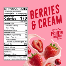 Nutrition Facts label next to a tub of FlavCity Berries & Cream Protein Smoothie powder, with fresh strawberries swirling in a splash of cream.