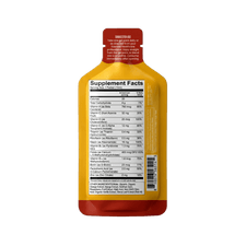 Back of a Shop FlavCity Multivitamin Gel Pack shows Supplement Facts, serving size, list of essential vitamins, suggested use instructions, and a barcode. The yellow and red pouch stands upright against a plain white background.