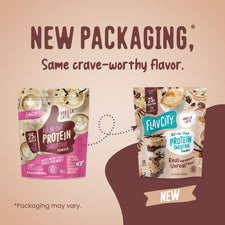 Two pouches of FlavCity Vanilla Latte Protein Smoothie powder are shown side-by-side to illustrate a design update, with text announcing new packaging for the same crave-worthy flavor.
