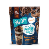 Shop FlavCity Chocolate Protein Smoothie bag showcases chocolate and banana smoothie graphics, emphasizing 25g grass-fed whey protein, 10g collagen, real ingredients, and 20 servings on the front—ideal for blending a rich chocolate protein smoothie.
