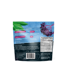 Back of a Shop FlavCity Immunity Tea - Elderberry package displaying ingredients, supplement facts, and a brand note. An illustration of elderberries—emphasizing their natural immune support—alongside decorative leaves appears on a blue background.