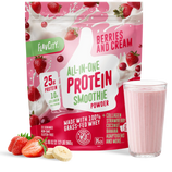 A bag of Shop FlavCity Berries & Cream Protein Smoothie sits next to a glass of pink smoothie, sliced strawberries, and banana on a white surface.