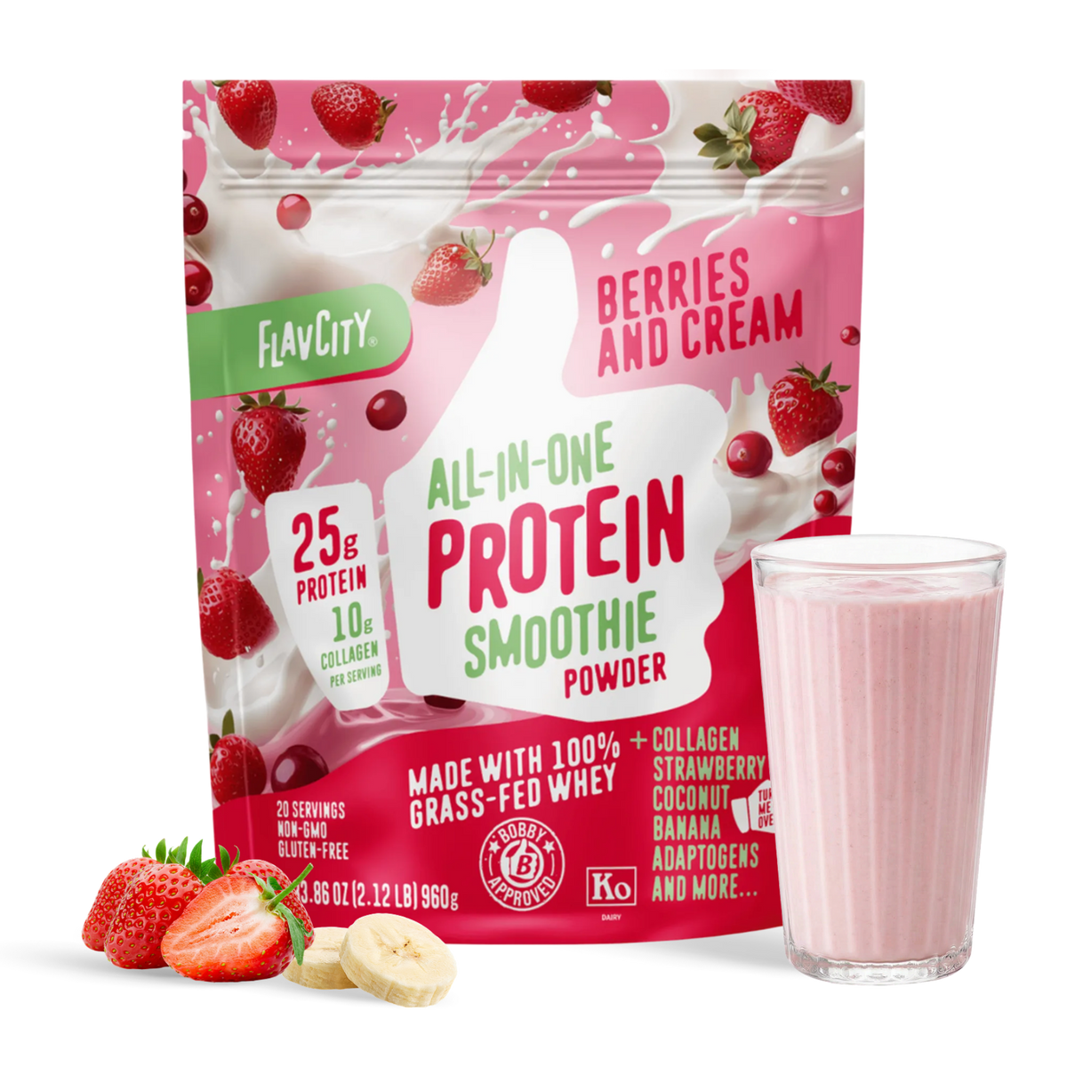 A bag of Shop FlavCity Berries & Cream Protein Smoothie sits next to a glass of pink smoothie, sliced strawberries, and banana on a white surface.