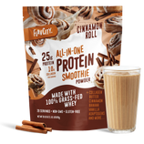 A bag of Shop FlavCity Cinnamon Roll Protein Smoothie stands behind a glass of smoothie and two cinnamon sticks, with images of cinnamon rolls and cinnamon sticks on the packaging.