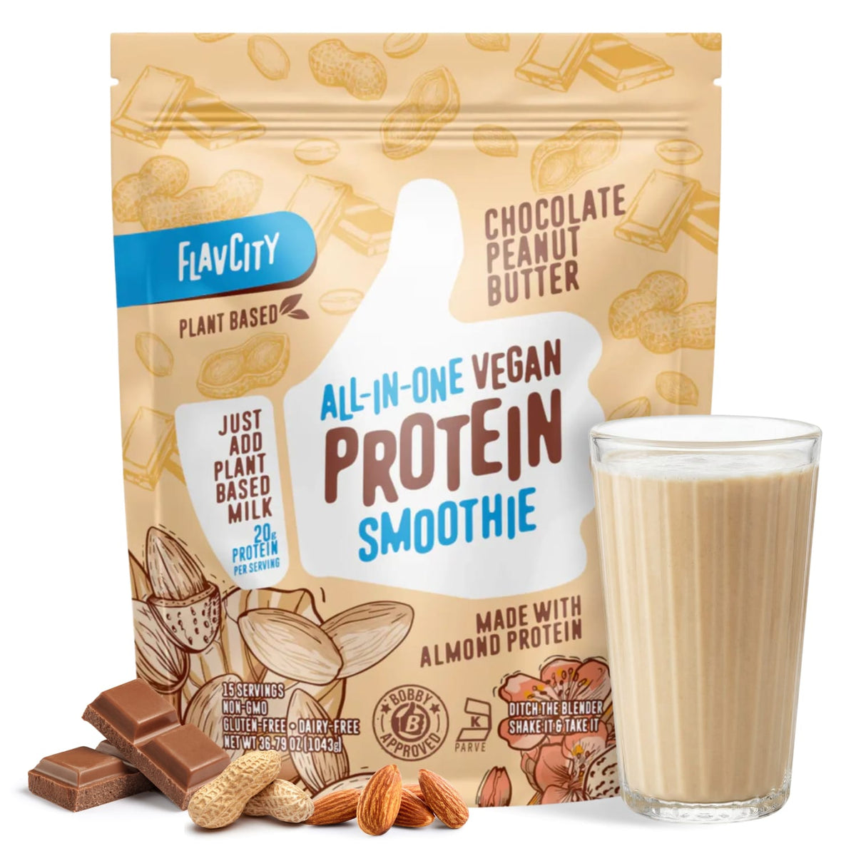 A package of Shop FlavCity Plant-Based Chocolate Peanut Butter Protein Smoothie stands behind a filled glass, with chocolate pieces, peanuts, and almonds scattered around to highlight this delicious dairy-free smoothie.