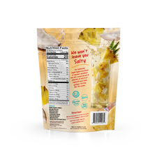A pouch of Shop FlavCity Pineapple Coconut Electrolyte Mix showing nutrition facts, ingredients, and directions alongside pineapple slices and coconut chunks.