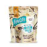 Shop FlavCity Vanilla Cream Protein Smoothie bag featuring images of vanilla flowers, a smoothie, and clear text highlighting 25g grass-fed whey protein, 10g collagen, 20 servings, and real ingredients.