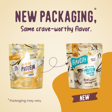 Two bags of Shop FlavCity Vanilla Cream Protein Smoothie in the new packaging. Each bag showcases vanilla flowers and highlights its protein content, emphasizing grass-fed whey and collagen for enhanced nutrition. A banner states: NEW PACKAGING, Same crave-worthy flavor.