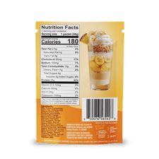 Back of FlavCity Cafe Tropical Sip (Teal) packet shows nutrition facts, ingredients, a photo of banana pudding dessert in a glass, and a barcode at the bottom. Contains grass-fed whey protein.