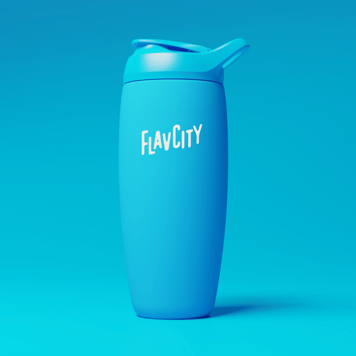 A blue reusable tumbler with a lid and spout, featuring the white text FLAVCITY on the front, stands upright against a matching blue background.