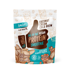 A bag of plant-based protein smoothie powder with a 'Vegan Coconut Cream Cold Brew' flavor, featuring a tropical design with coconut and coffee imagery on the packaging.