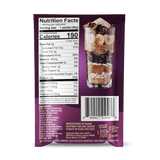 A nutrition facts label on a purple Shop FlavCity Protein Smoothie: Single-Serve Packet shows 190 calories per serving. The package features a tall glass with layers of bananas, chocolate, and other dessert-inspired ingredients.